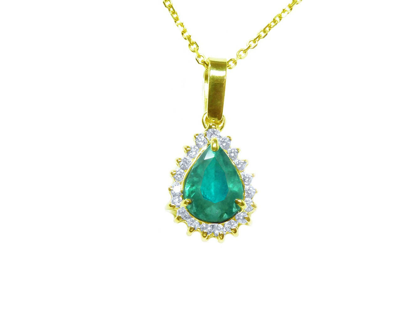 Gold pendant with a natural teardrop colombian emerald on a topside position view.