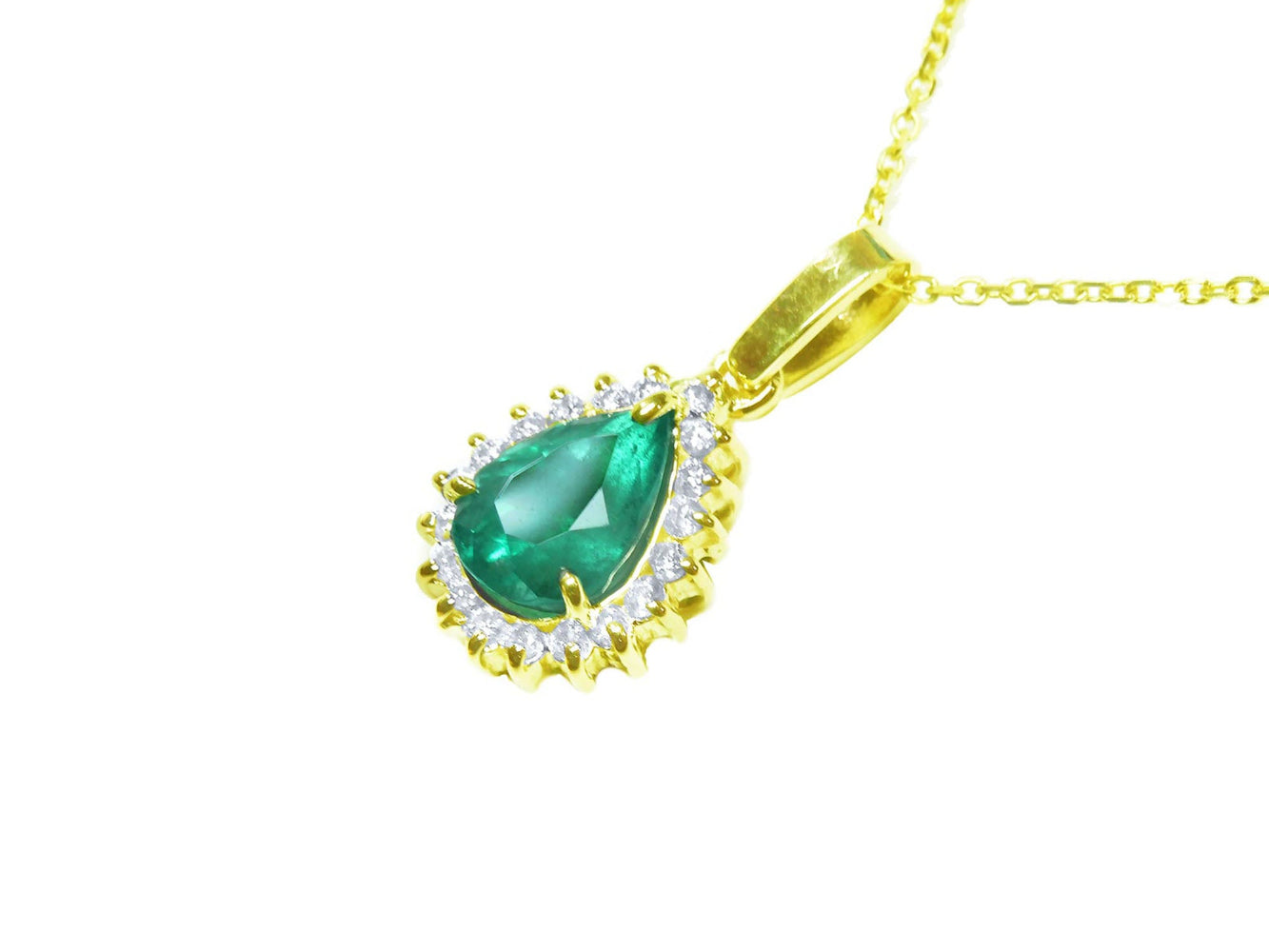 Gold pendant with a natural teardrop colombian emerald and diamond accents on a left side profile view.
