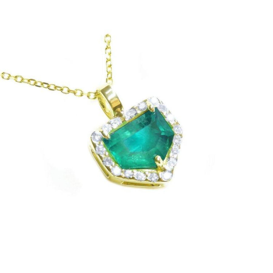 14k Yellow gold pendant with a natural colombian emerald and diamond accents. 