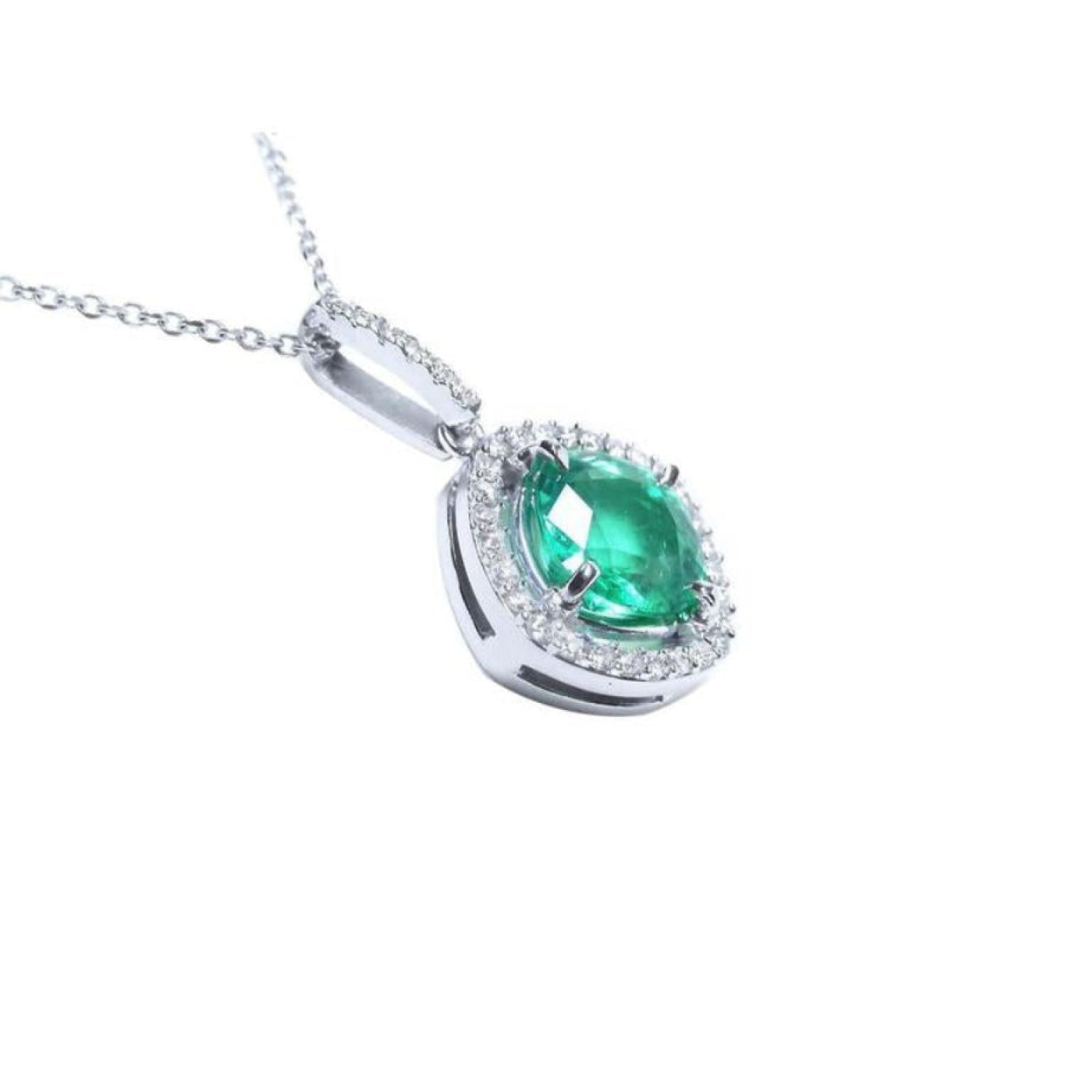 Cushion-cut Colombian emerald pendant with diamond halo in 14K white gold.