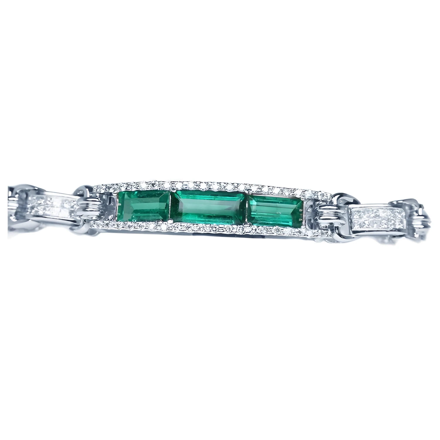 White gold bracelet with three rectangular Colombian emeralds surrounded by princess cut diamonds.