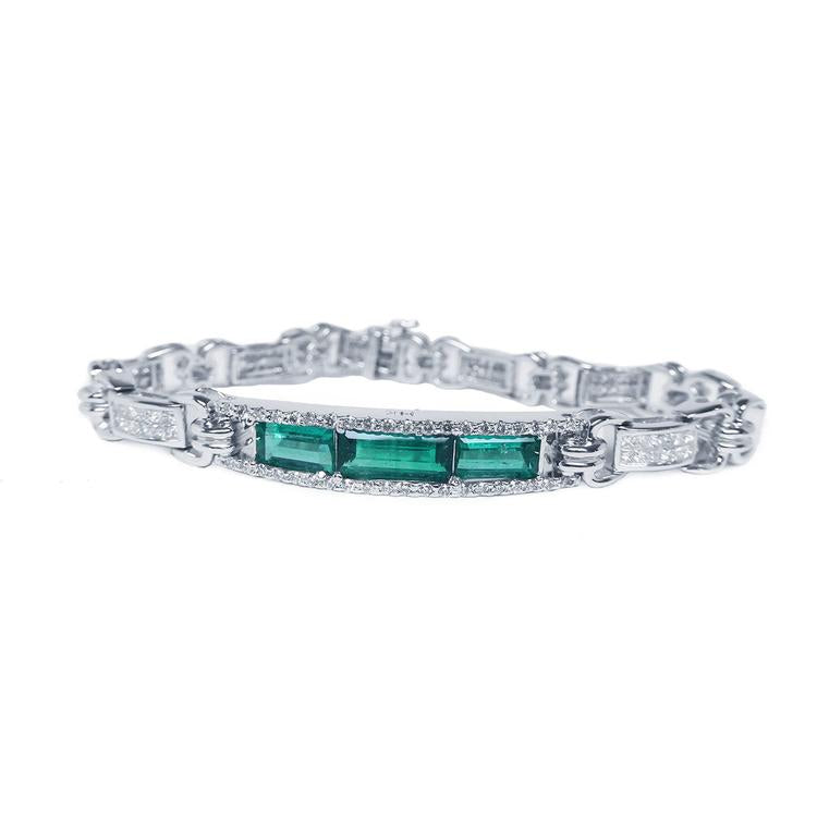 This bracelet features 2.95 carats of vibrant Colombian Muzo emeralds paired with 3.28 carats of natural princess cut diamonds.