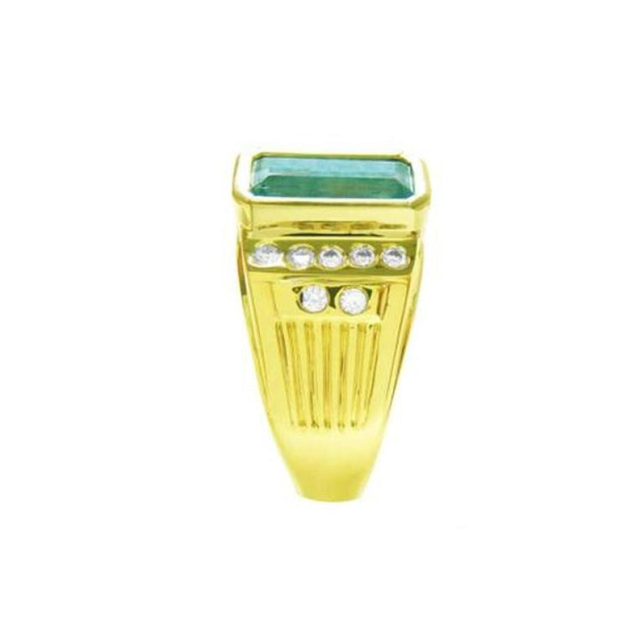 Men's 14K yellow gold ring with a bezel-set Colombian emerald and burnish-set diamonds.