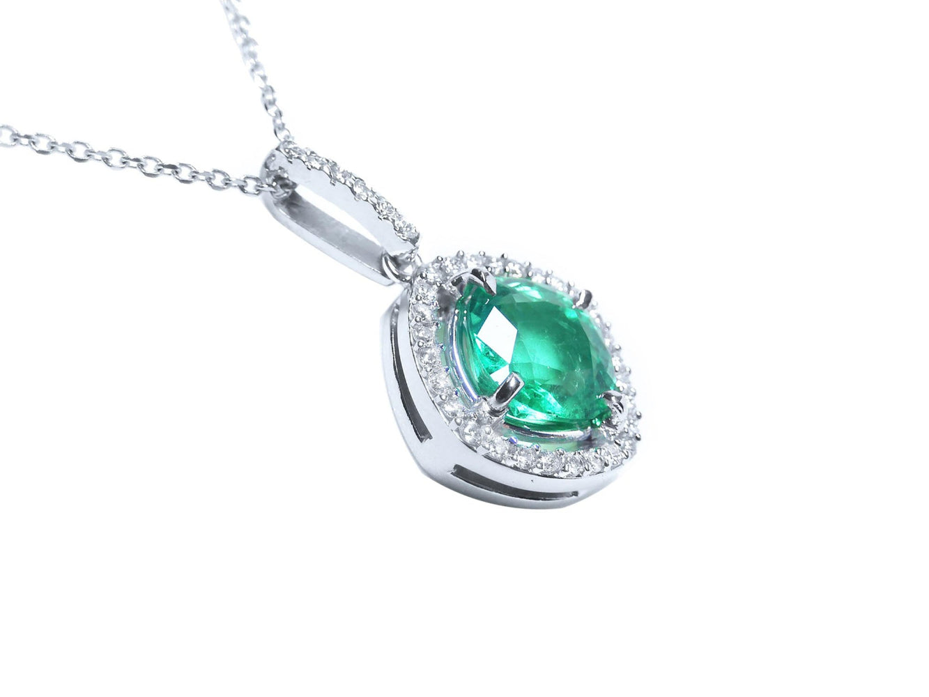 Emerald cushion cut gemstone pendant on a right-side profile gallery view.