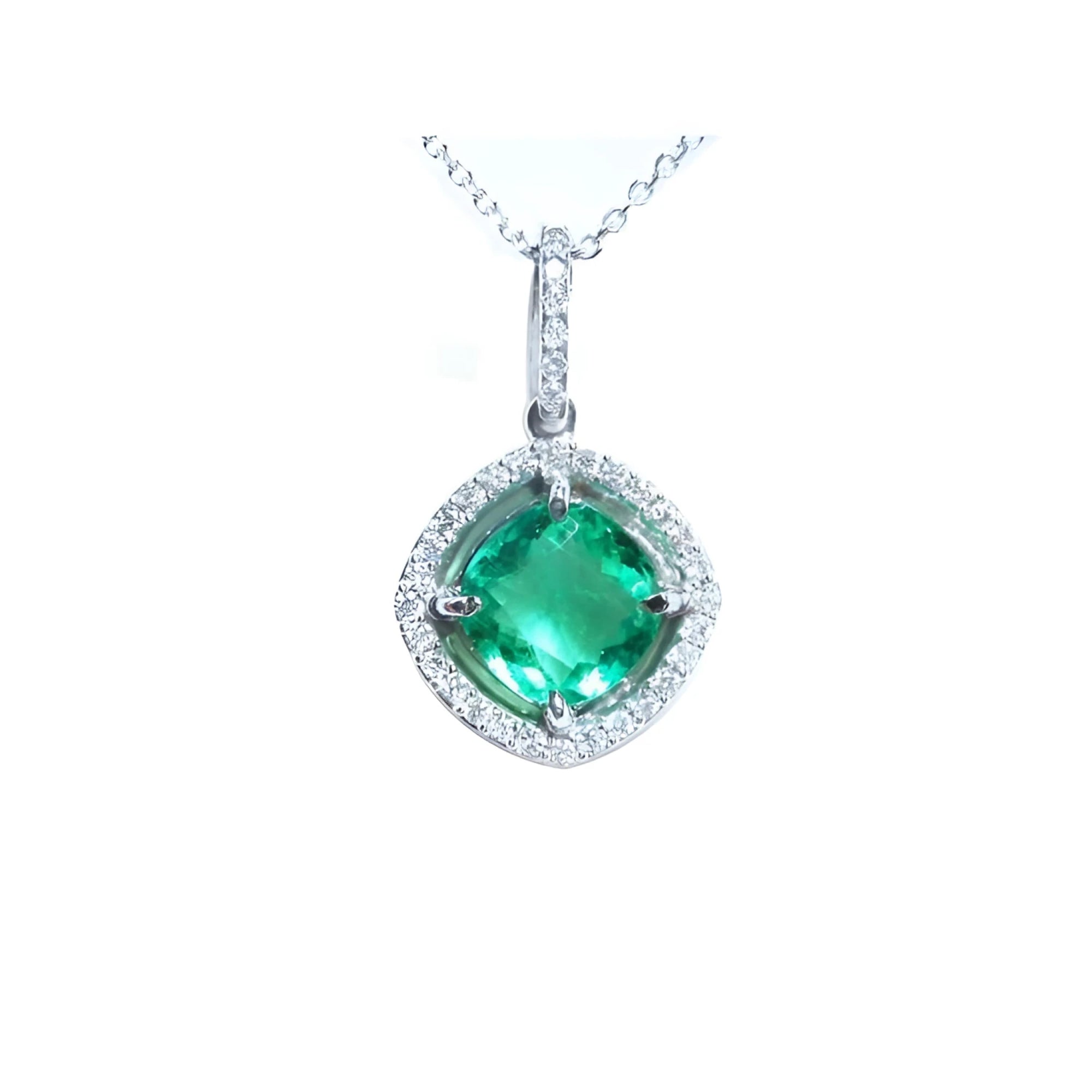 Cushion-cut Colombian emerald pendant with halo diamonds in 14K white gold on a delicate chain.