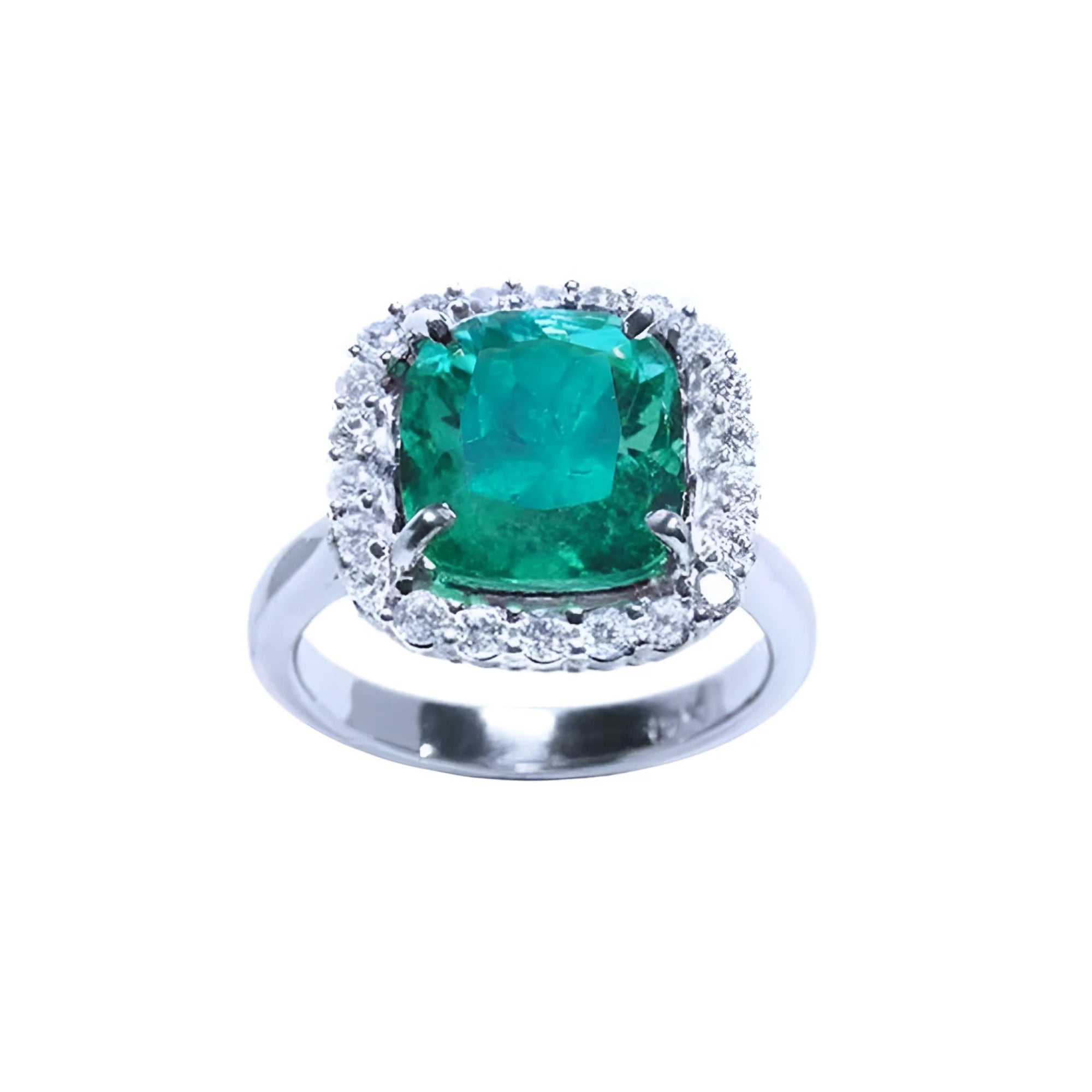 This cushion cut natural Colombian emerald ring for women has a halo of genuine diamond and is made of 18k white gold.
