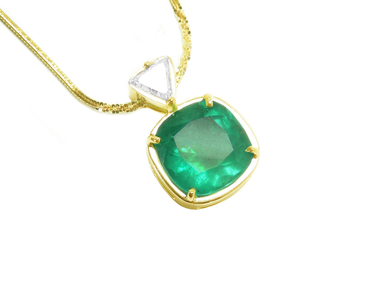 Gold necklace with a natural colombian emerald pendant on a white background