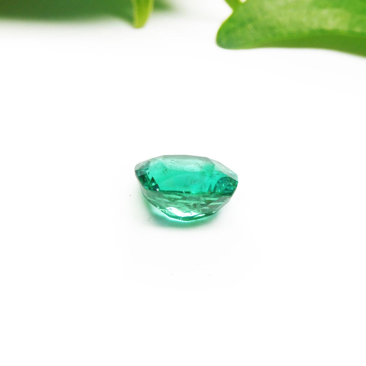 GIA certified loose natural Colombian emerald cushion cut, underside girdle and pavilion view