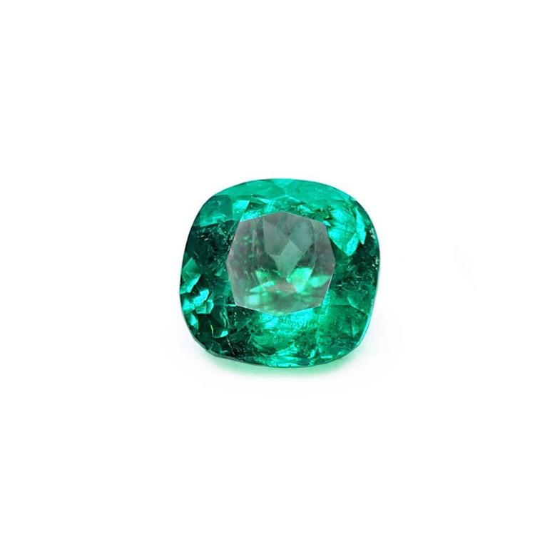 Cushion cut loose emerald from muzo Colombia, sparkling medium-deep bluish green color.