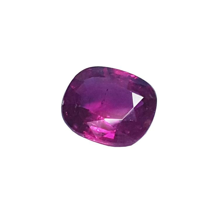 1.18 carat loose natural ruby gemstone with a cushion cut and vibrant red hue.