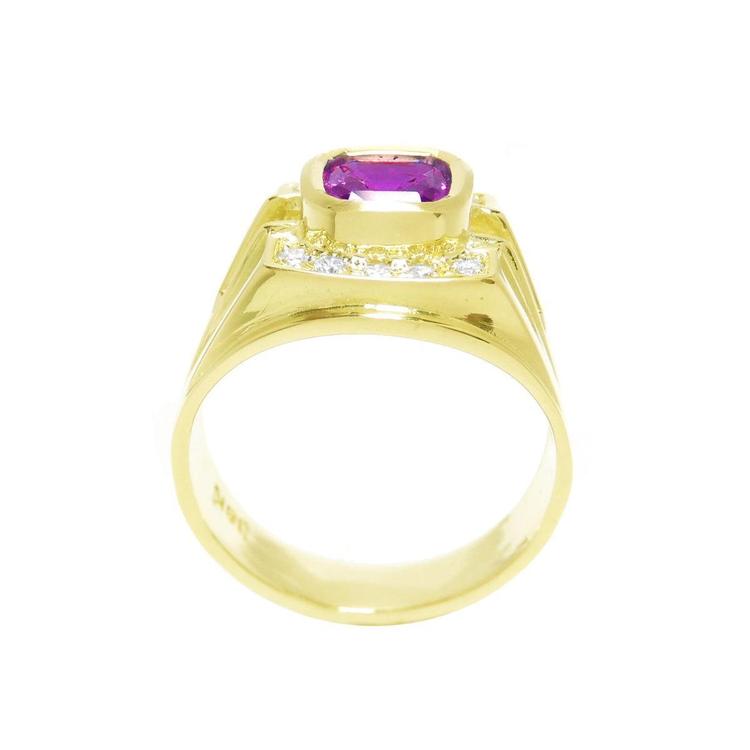 Men's 18K yellow gold ring with a bezel-set cushion-cut purplish-pink sapphire and diamond accents.