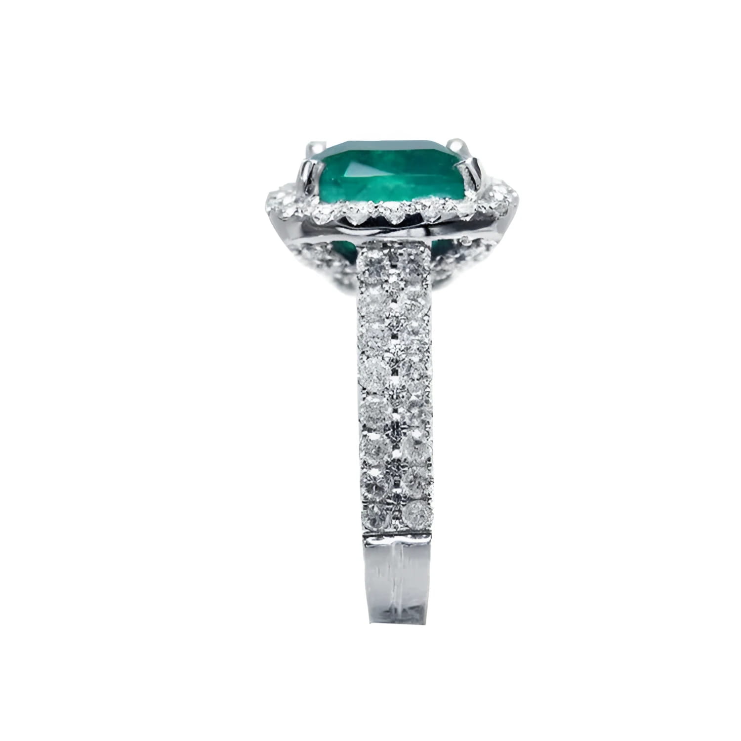 Cushion cut 3.92 ct. natural emerald ring in 14K white gold with diamond halo and pavé band.