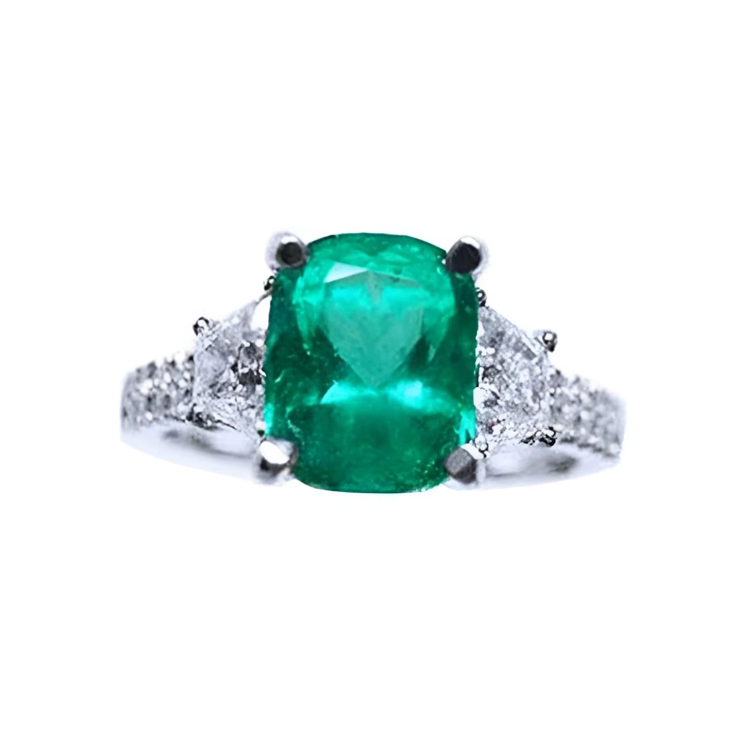 Ring with a cushion cut emerald gemstone and trapezoid diamond accents on each side in white gold.