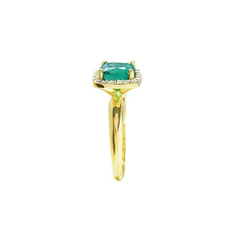 1.45 ct natural cushion-cut emerald ring with diamond halo in 14K gold.