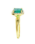 The side profile of this natural emerald ring displays the side of the gem and downside of the band.