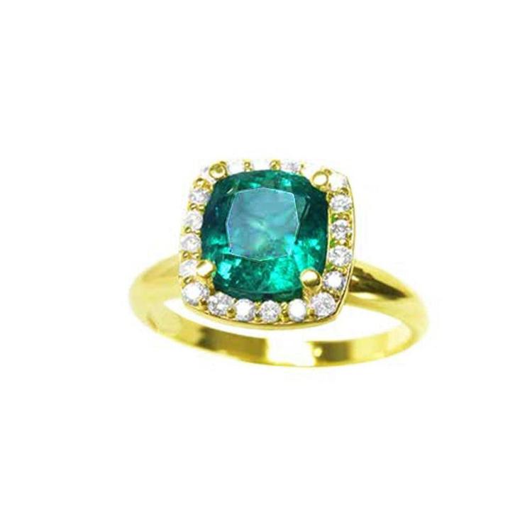 A natural cushion cut colombian emerald ring for women with halo diamond crafted in 14k yellow gold.