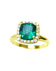 A natural cushion cut colombian emerald ring for women with halo diamond crafted in 14k yellow gold.