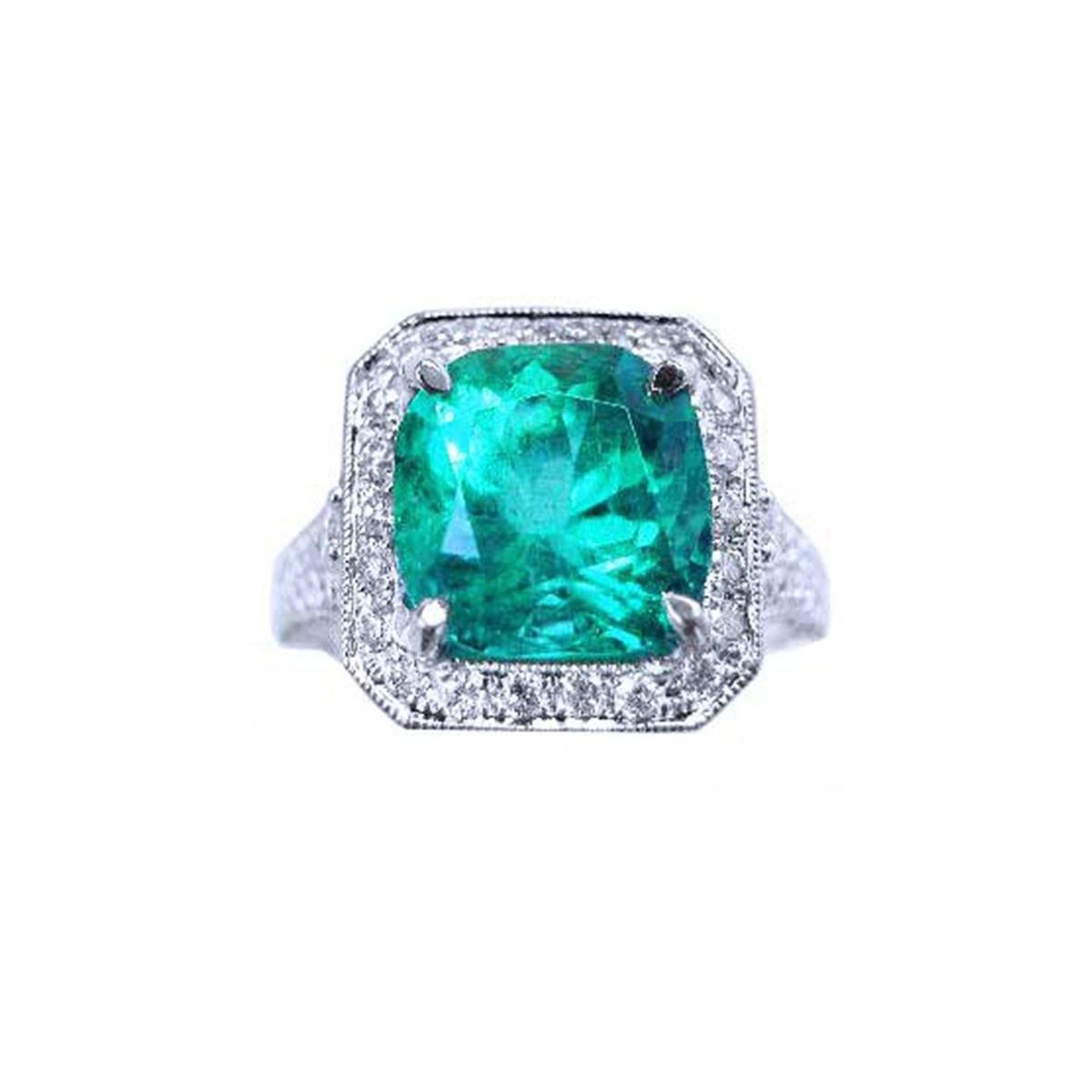 This cushion cut emerald engagement ring with a halo natural diamond in white gold is on a top side position.