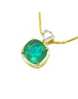Cushion cut 4.84 ct natural emerald pendant in 18K yellow gold with a small diamond accent.