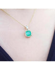 1.99 ct cushion-cut emerald pendant with halo natural diamonds on a 14K yellow gold chain.