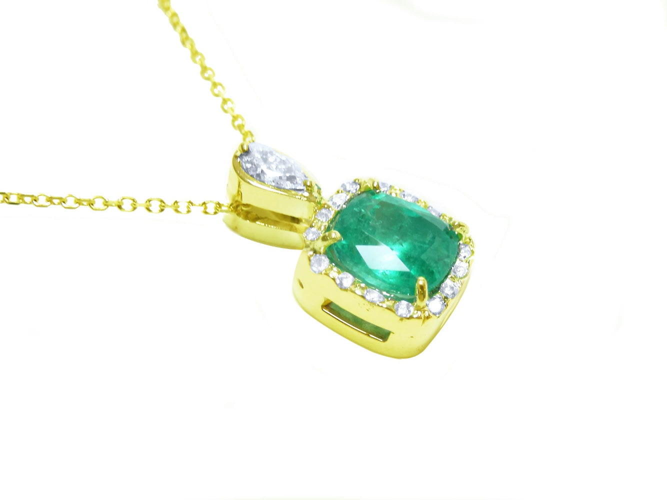 A right-side profile display of a gold cushion cut emerald pendant, top and gallery visibles.