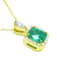 A right-side profile display of a gold cushion cut emerald pendant, top and gallery visibles.