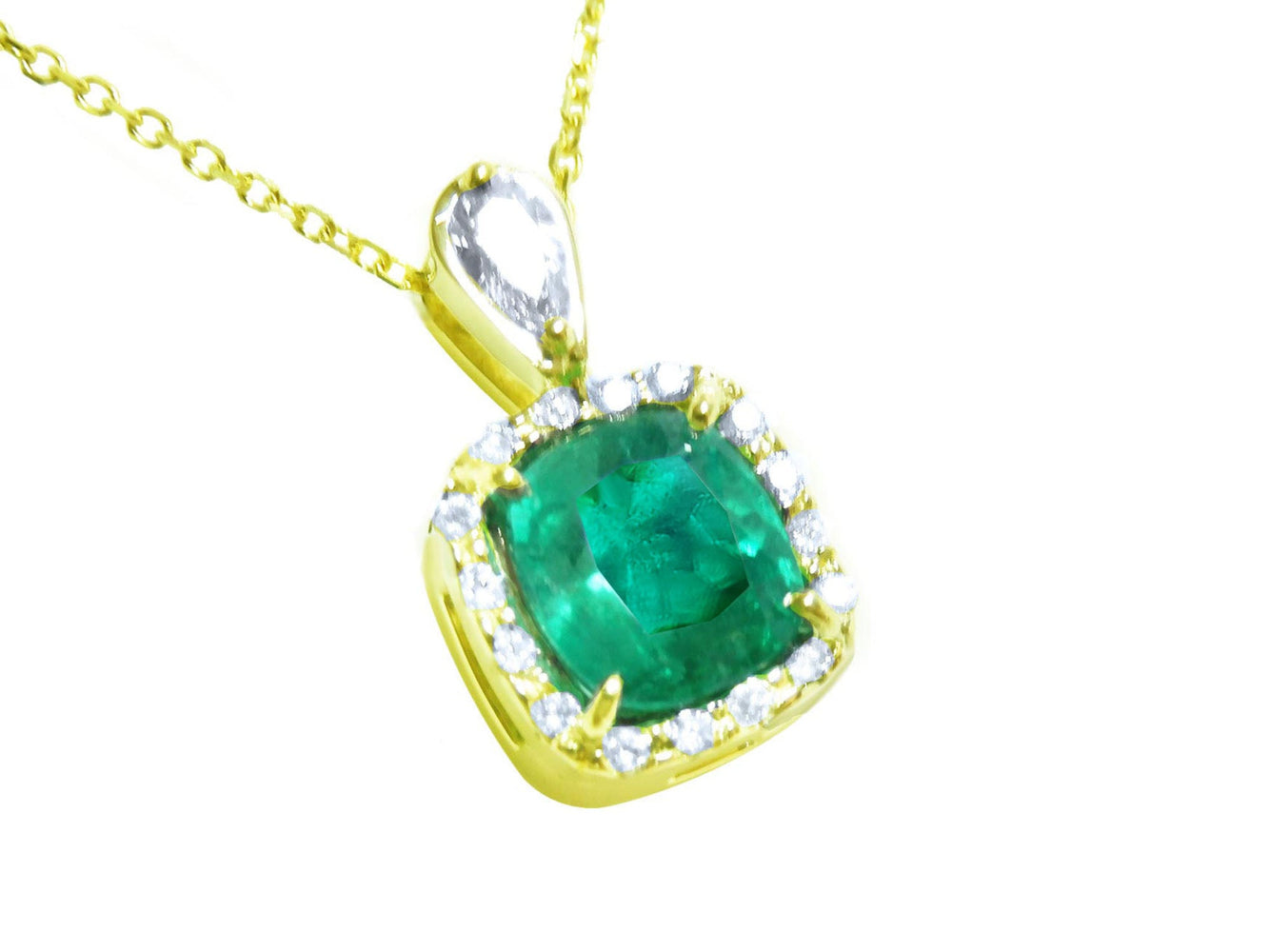 A yellow gold pendant with a cushion cut natural emerald in the center surrounded by a halo diamond right side profile.