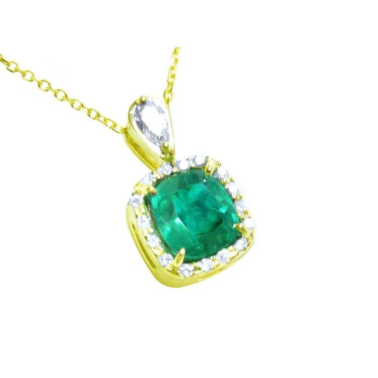 A yellow gold pendant with a cushion cut natural emerald in the center surrounded by a halo diamond right side profile.