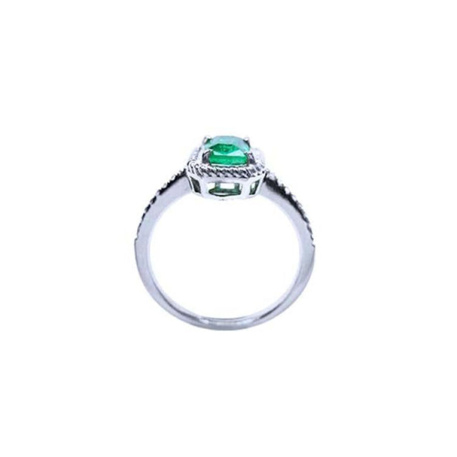 14K white gold cushion-cut emerald solitaire ring with rope detailing.