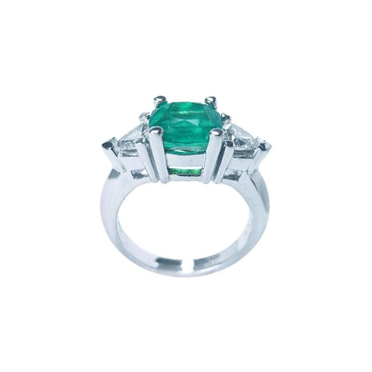 2.18 ct cushion cut Colombian emerald ring with trillion side diamonds in 14K white gold.