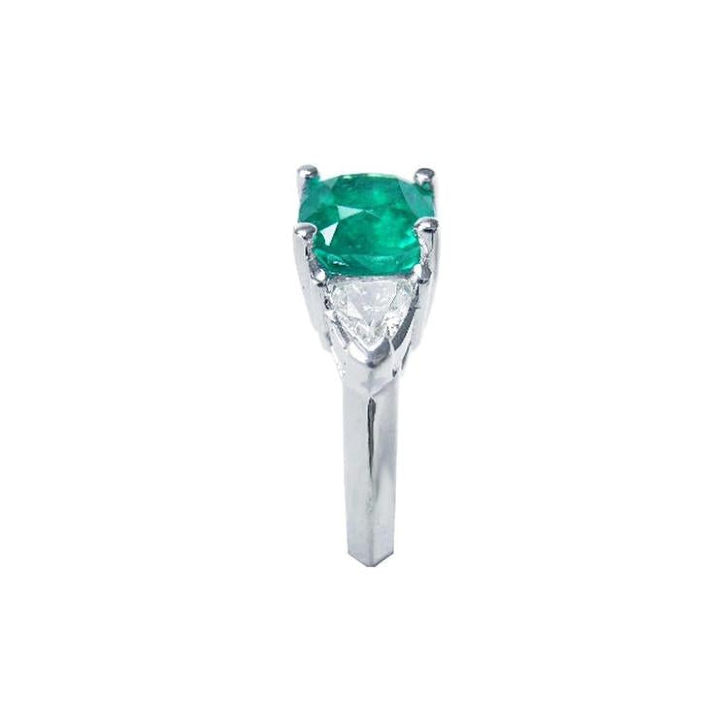 2.18 ct cushion cut emerald ring with trillion side diamonds in 14K white gold.