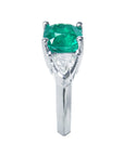 From the top side profile view of a 14k white gold ring for women cushion cut and trillion side diamonds.