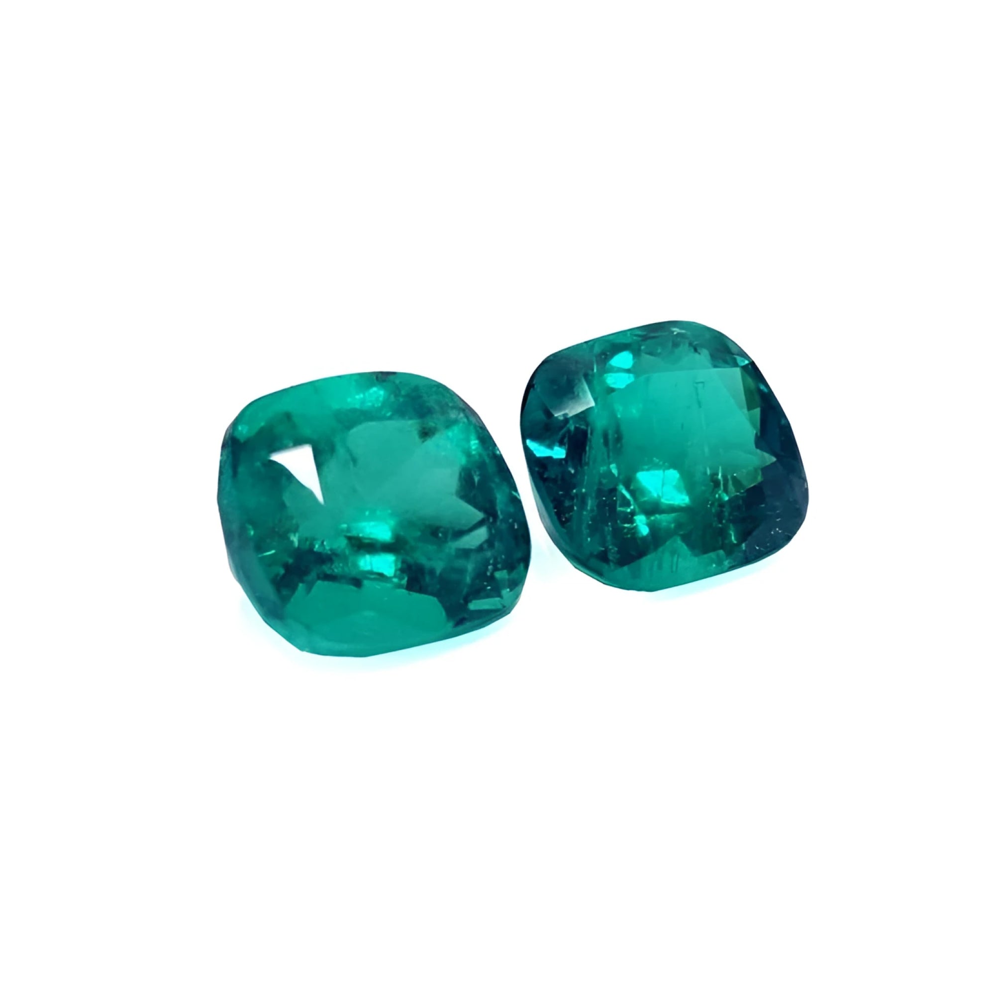 Matching pair cushion cut loose colombian emeralds perfect for a unique design of high quality jewelry.