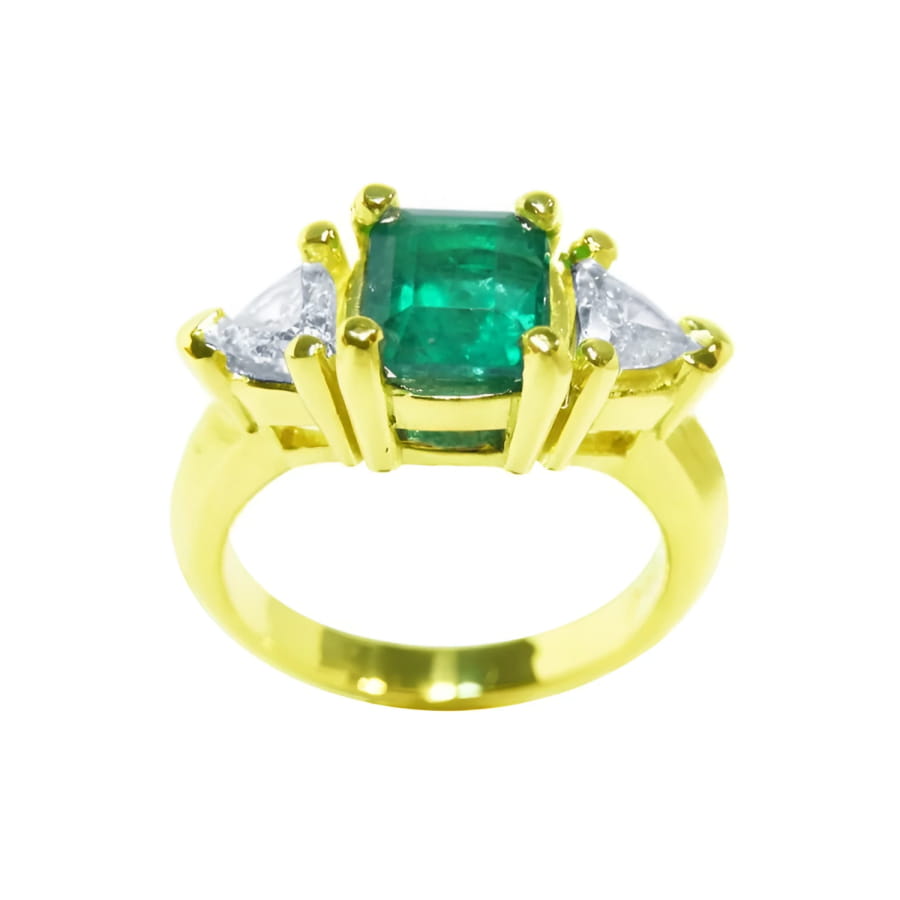 18k yellow gold natural colombian emerald and trillion cut side diamond ring for women.