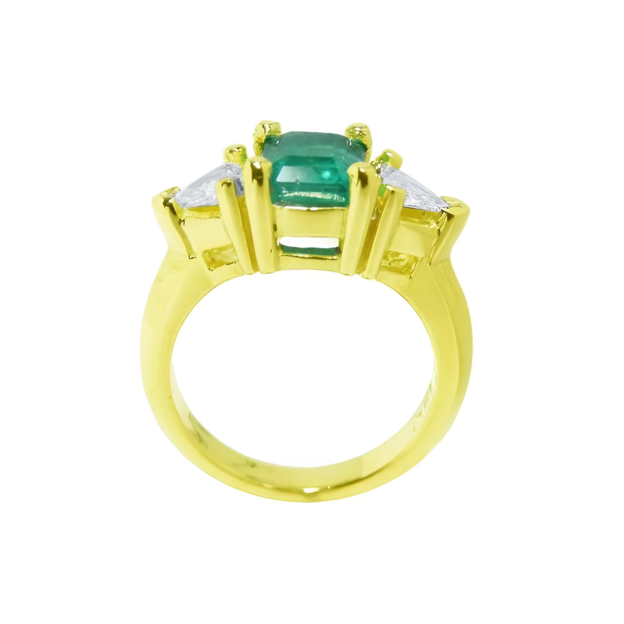 1.47 ct emerald-cut Colombian emerald ring with trillion diamonds in 18k yellow gold.