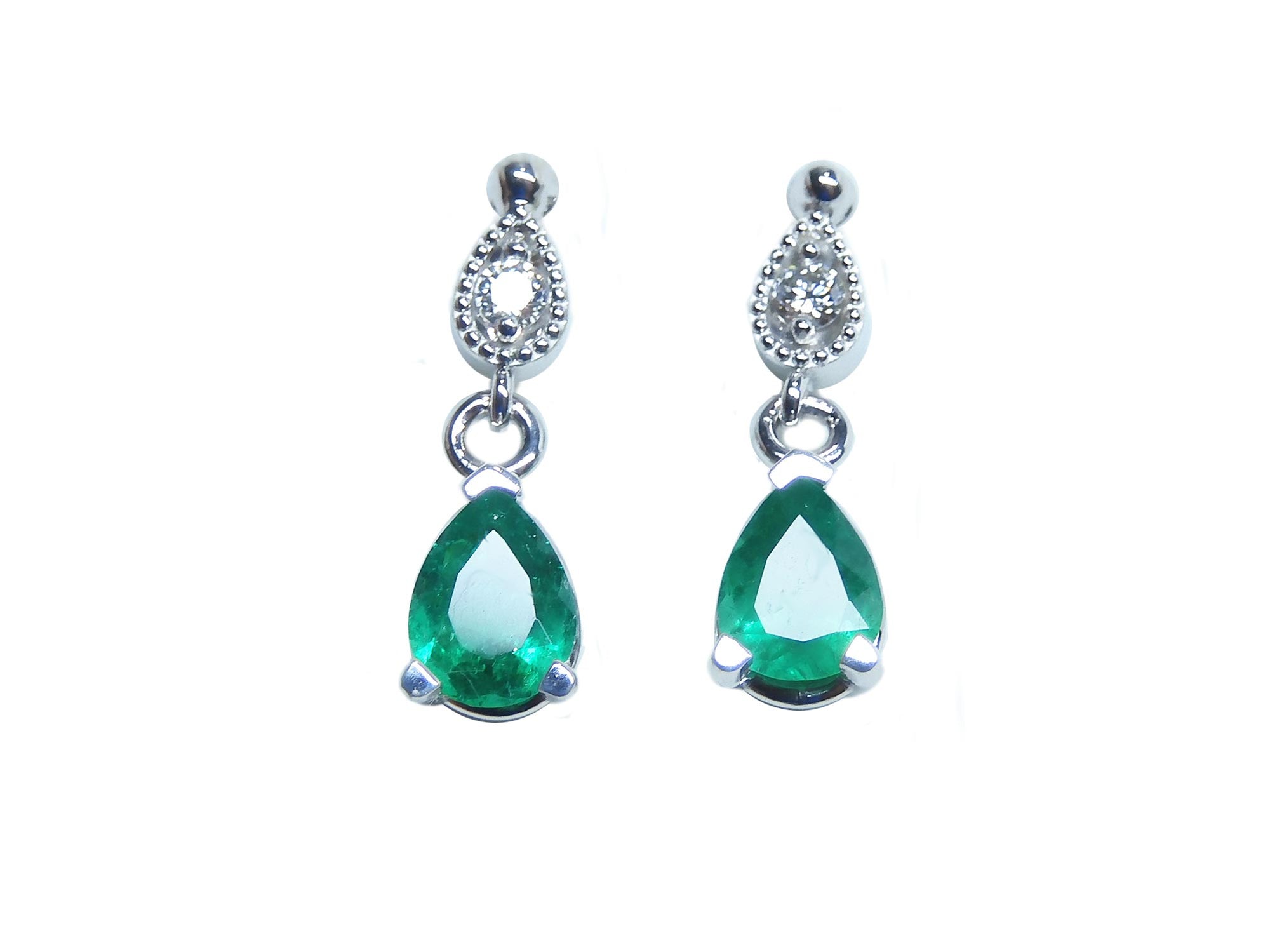 Front position of a pair of emerald teardrop earrings white gold plain top view