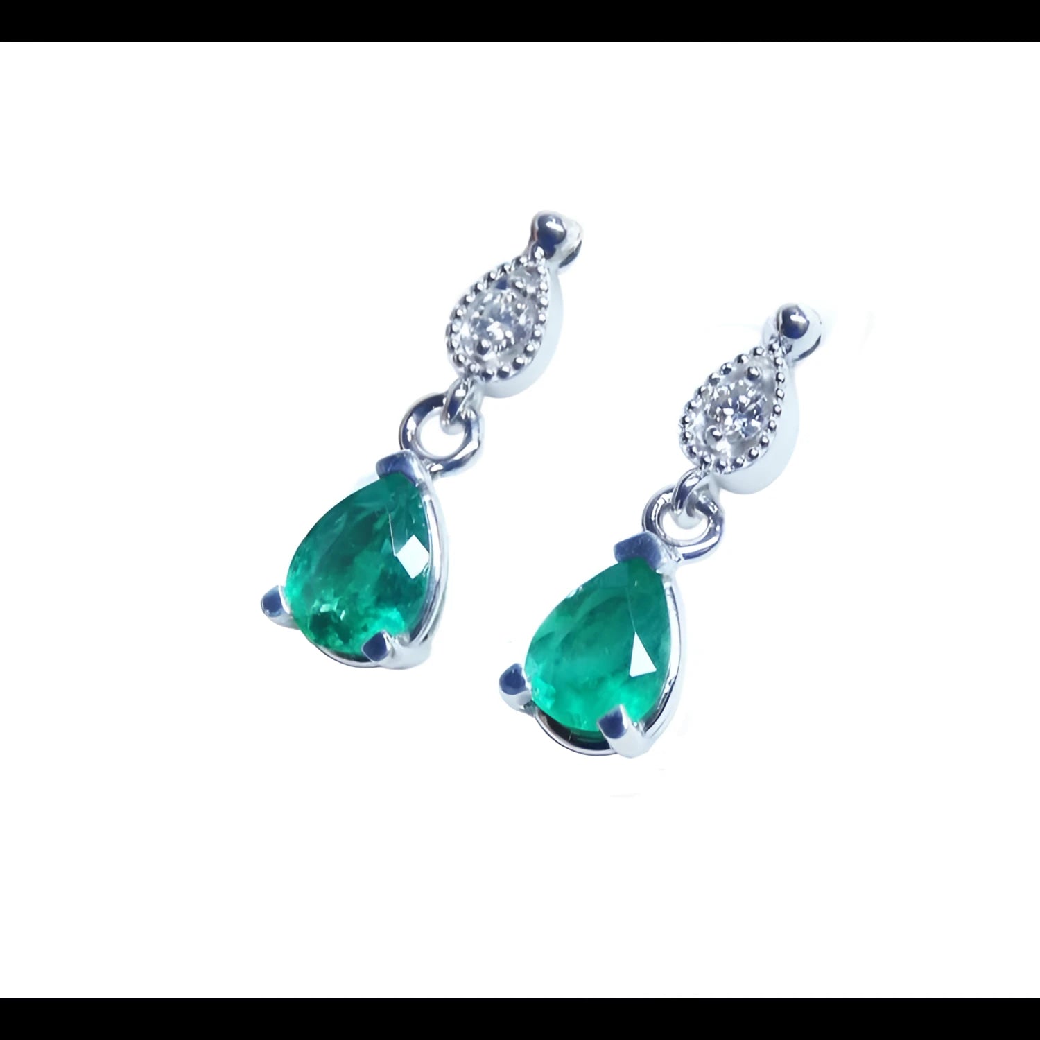 Dangling teardrop emerald earrings with diamond-studded pear links in 14K white gold.