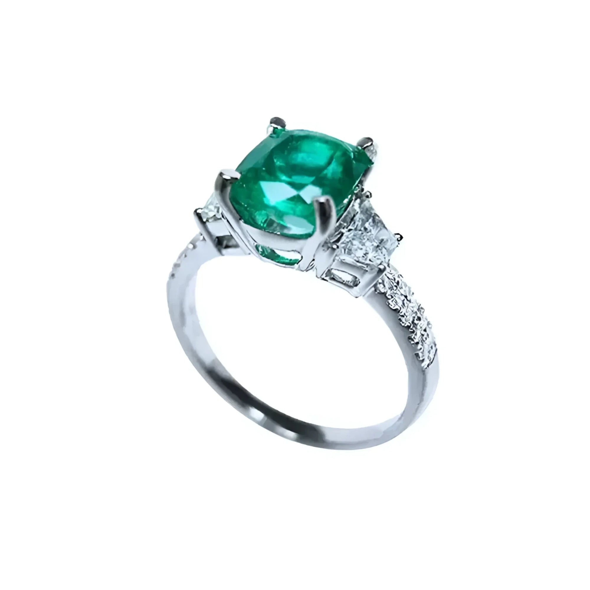 Anillo de compromiso de oro blanco 18k con esmeralda colombiana ovalada y diamantes trapezoide.