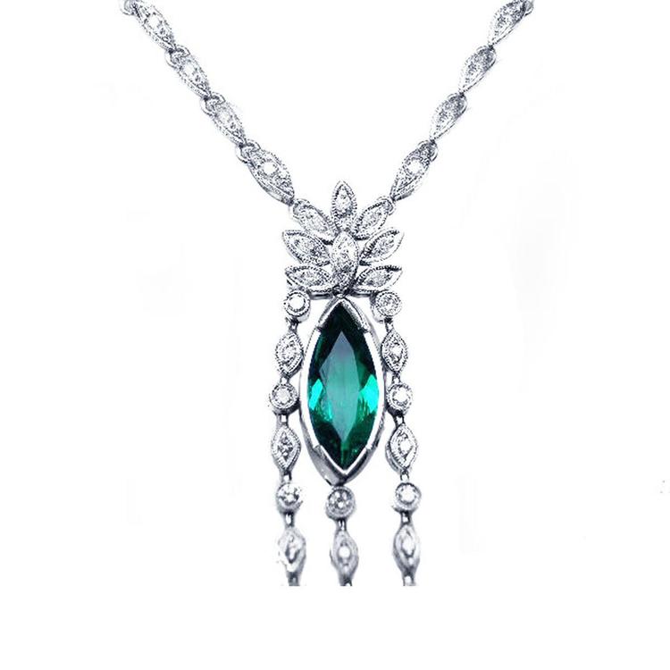 close view of a Marquise Necklace 2.12 ct. Colombian Emerald 14K White Gold on white background