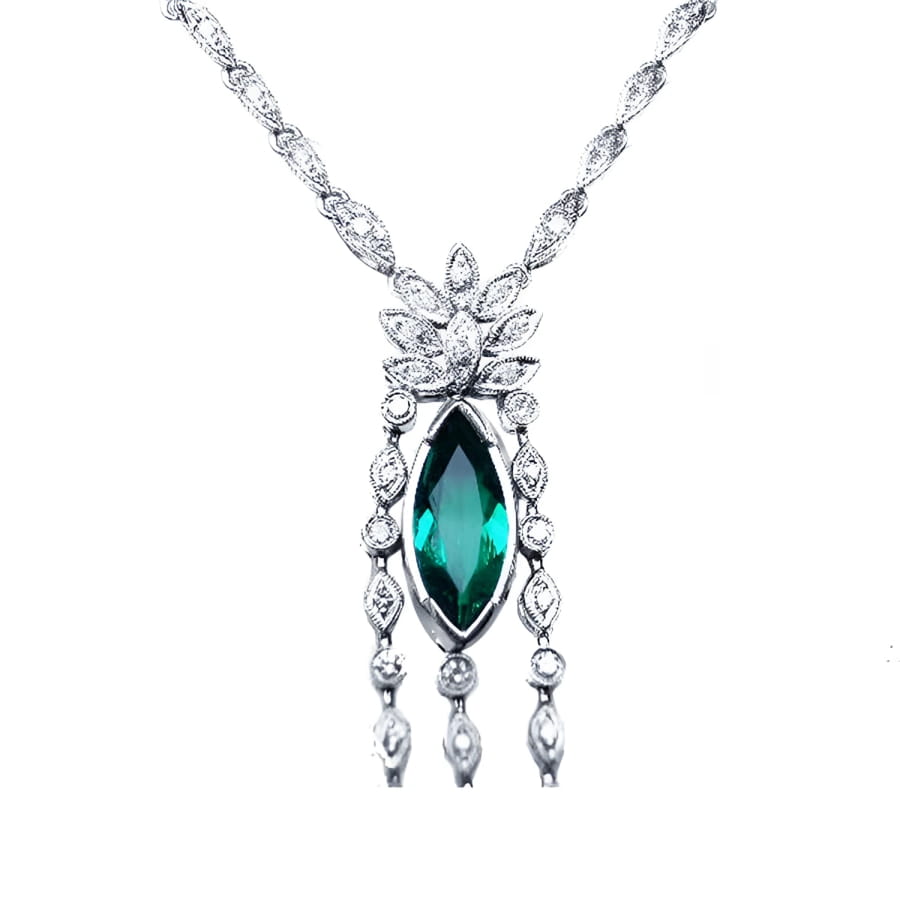 Marquise cut Colombian emerald necklace in 14K white gold with diamond links.