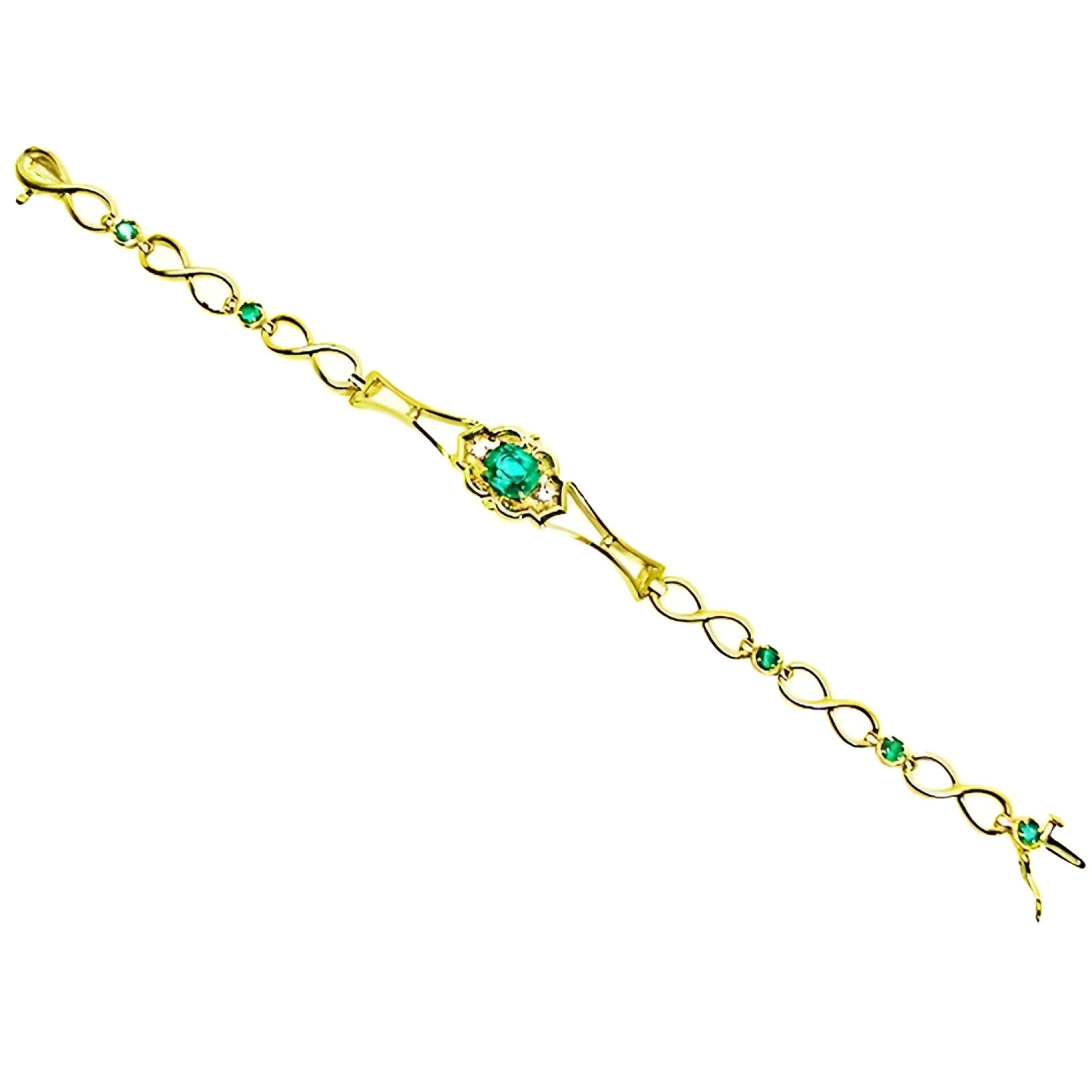 14K yellow gold bracelet with a central oval emerald and smaller emerald accents.