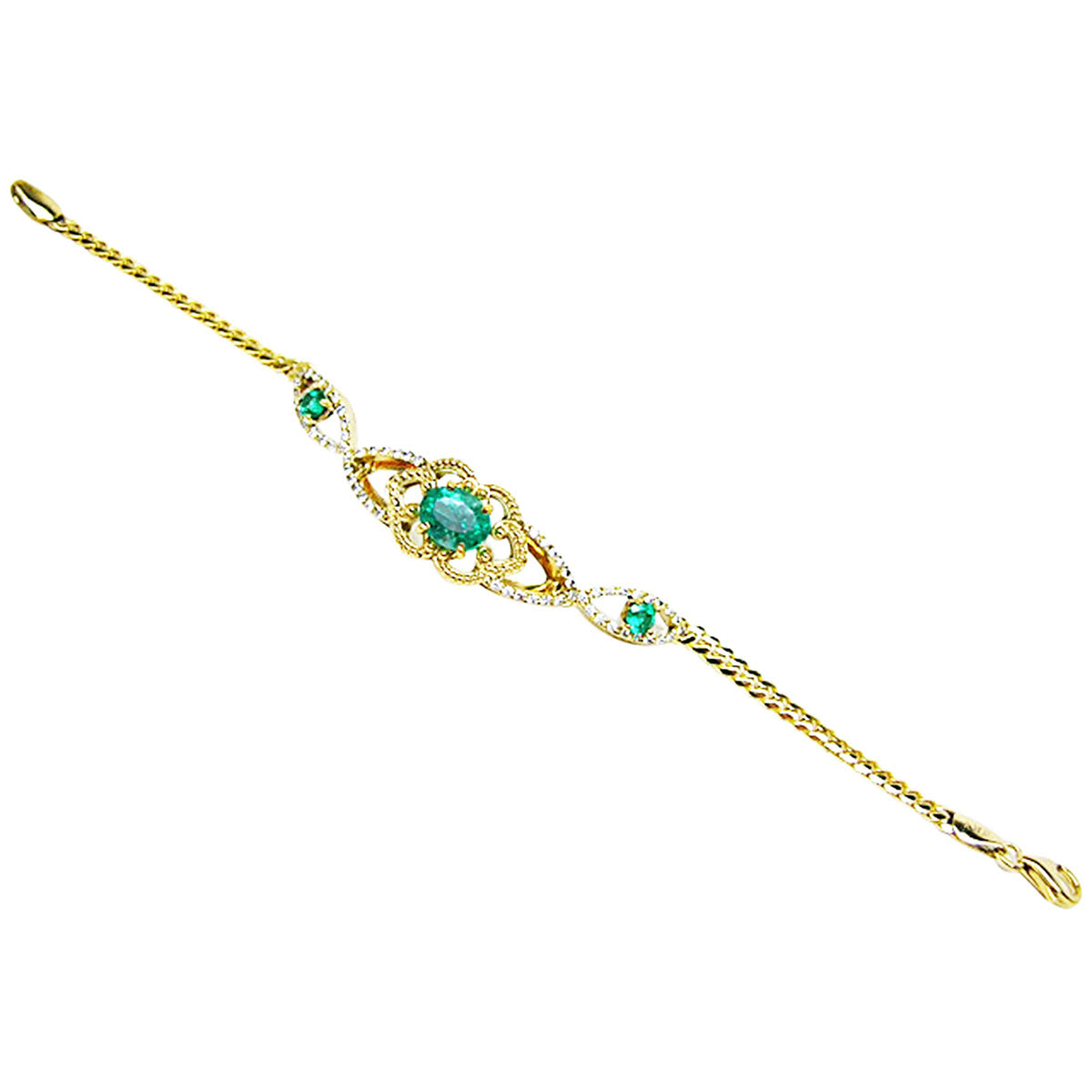 A distant view of a gold bracelet with emeralds gemstones on a white background.