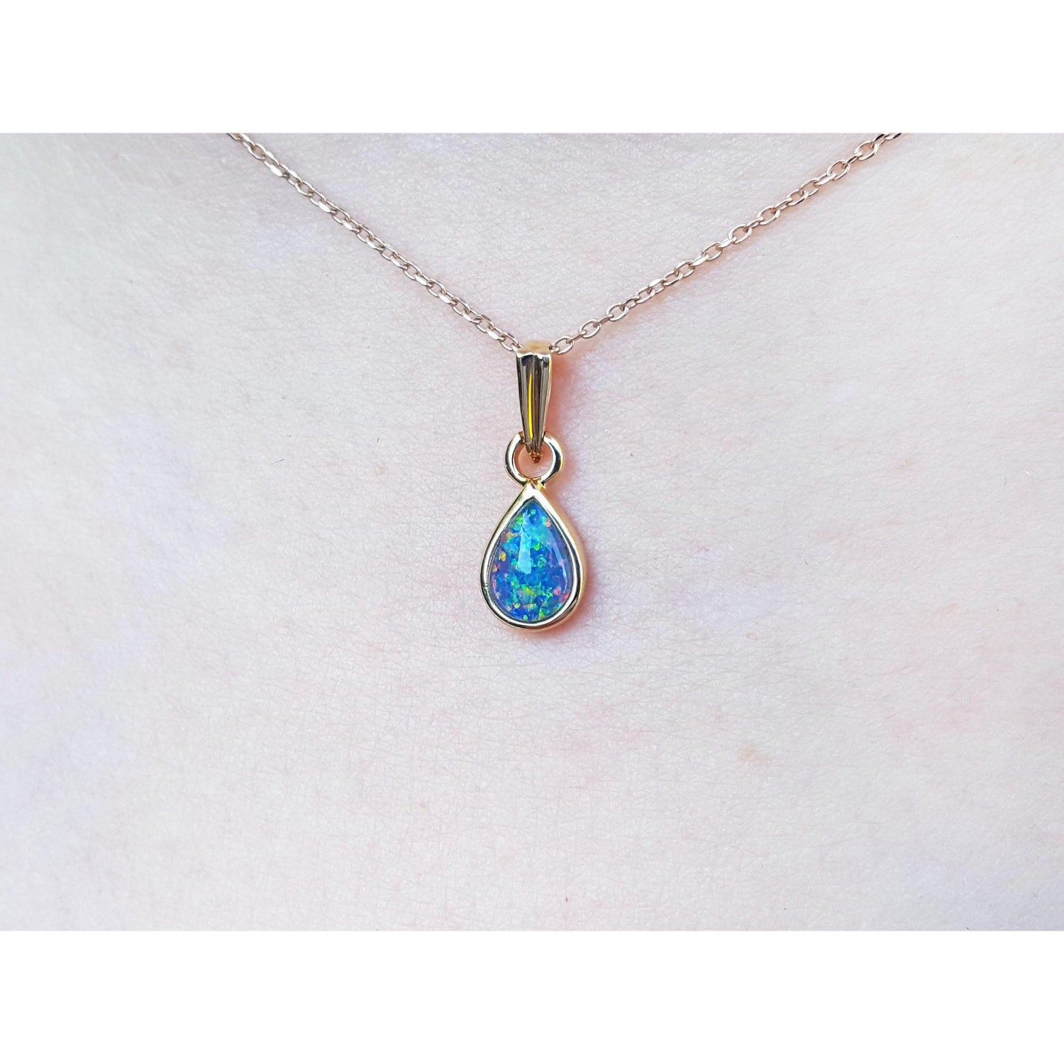 Opal pendant necklace on a skin background