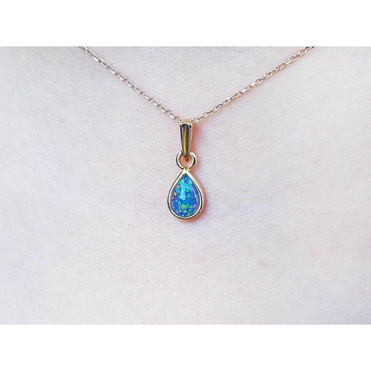 Opal pendant necklace on a skin background