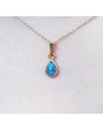 Opal pendant necklace on a skin background