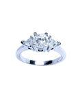 14K white gold engagement ring with a round center diamond and two trillion side diamonds.