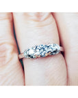 Round cut diamond engagement ring three stone crafted in 14k white gold.