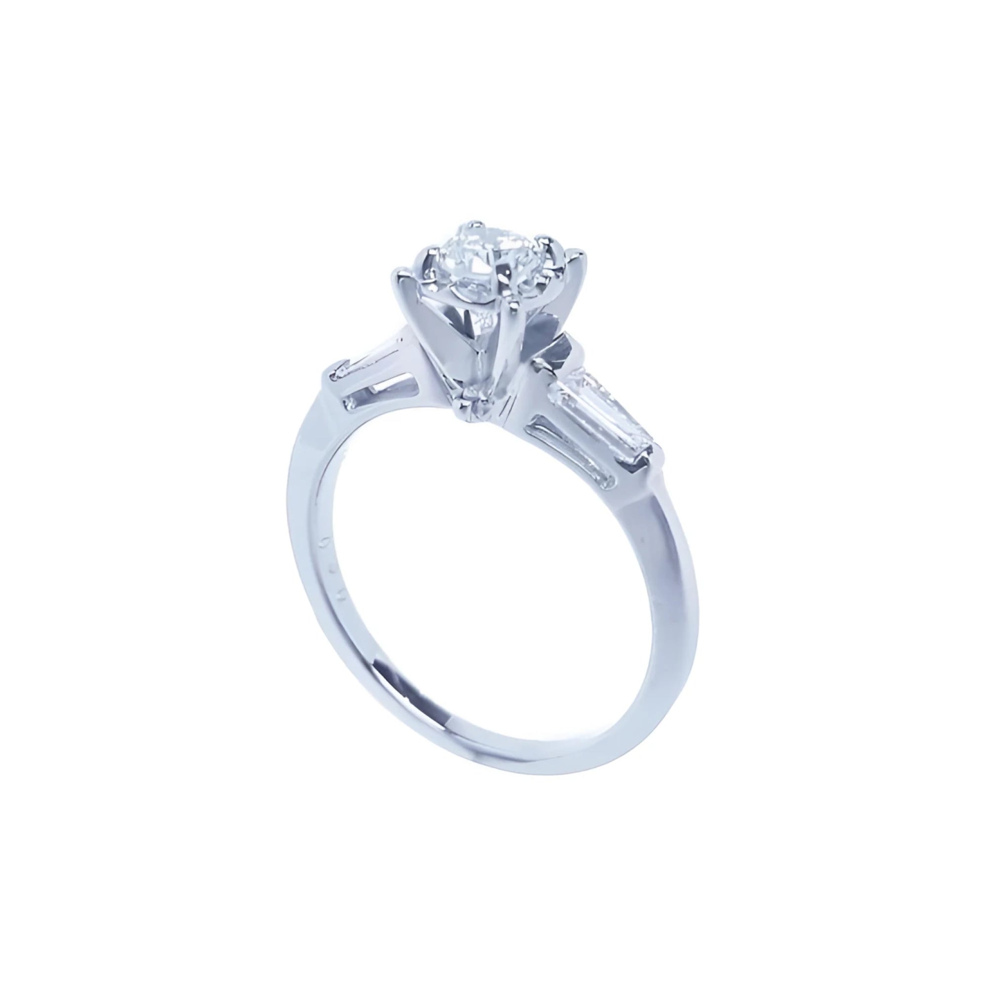 14k white gold engagement ring with a round central diamond and baguette side diamonds.
