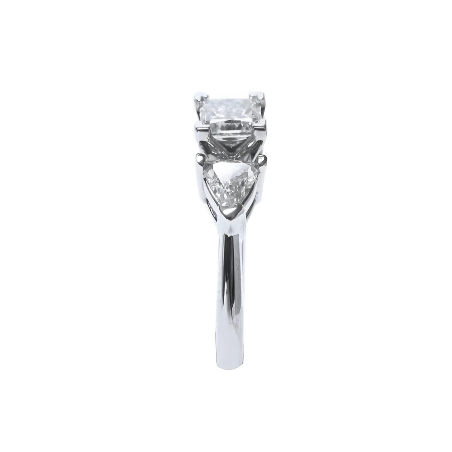 14K white gold ring with a princess cut diamond flanked by two trillion side diamonds.