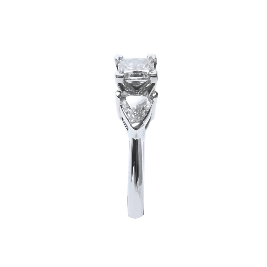 14K white gold ring with a princess cut diamond flanked by two trillion side diamonds.